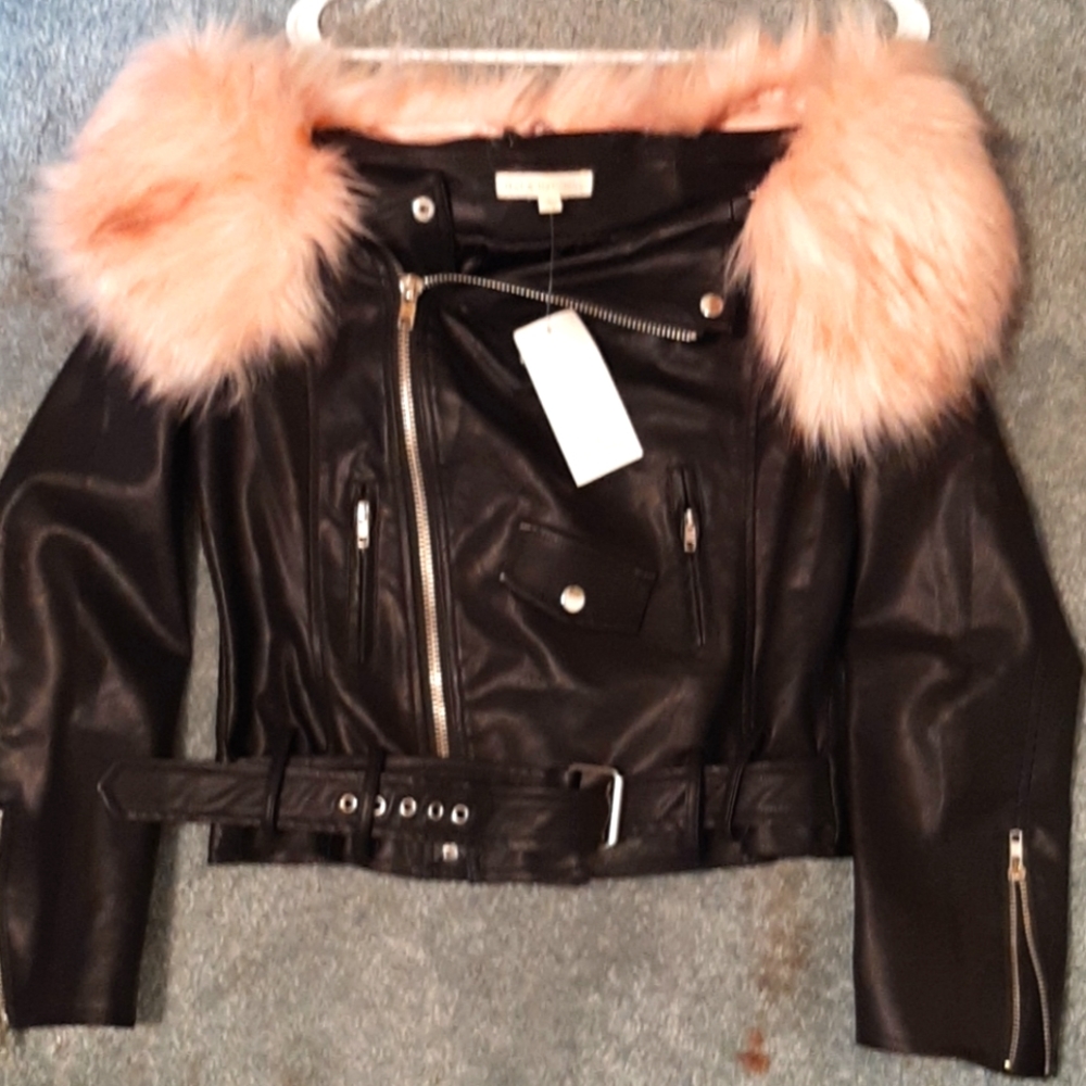 Faux leather jacket with removable pink fur.